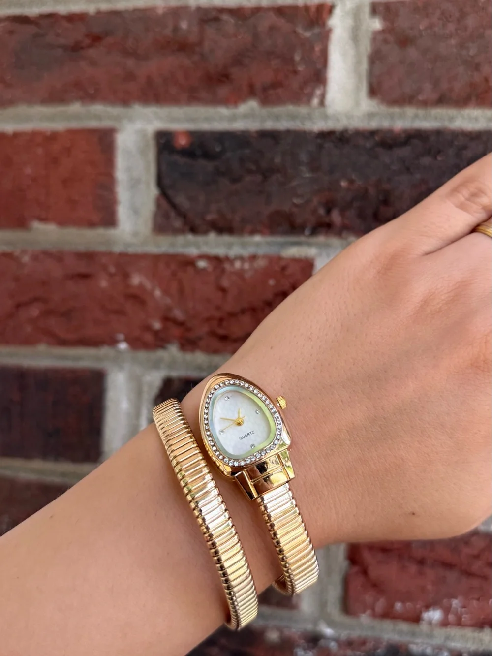 Gold serpentine bracelet watch
